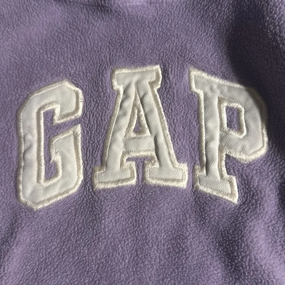 Gap size 3 years girls, purple with white gap little tears on cuff of the sleave